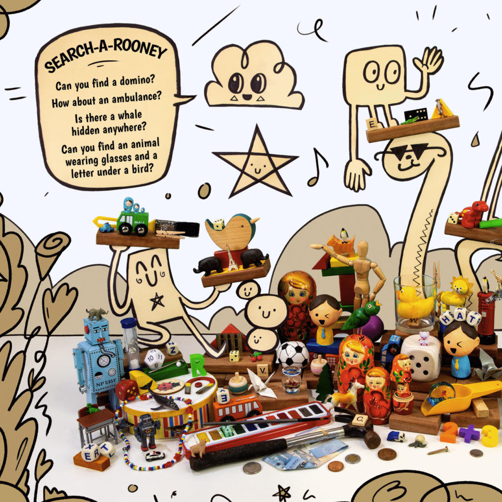 A colourful selection of toys, drawings, and small objects arranged together with a cloud talking about objects to find.
