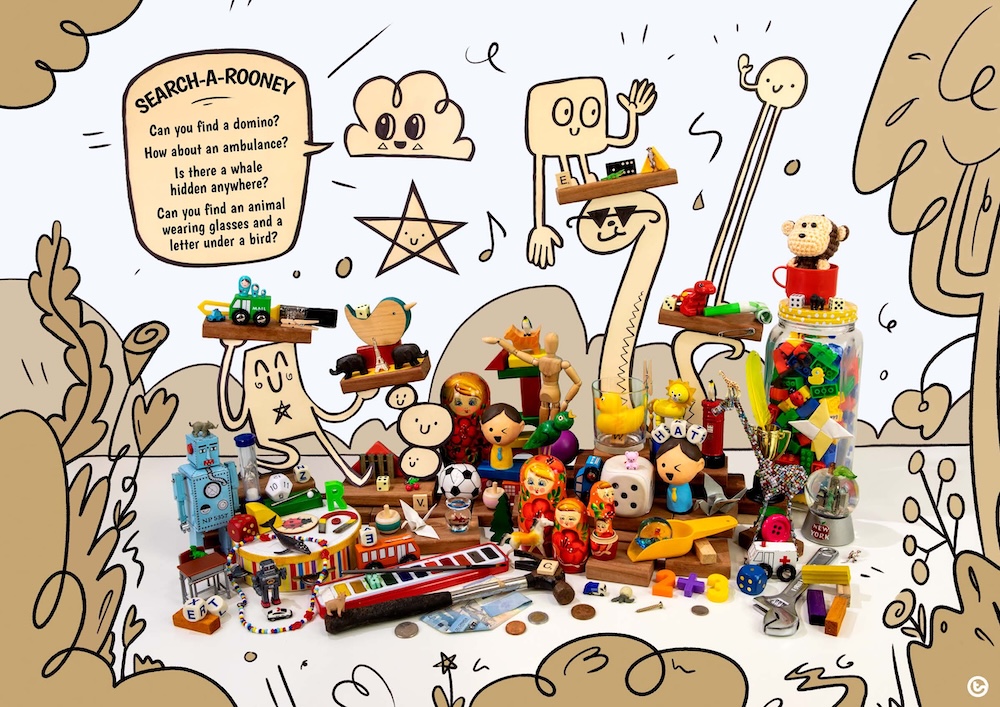 A colourful selection of toys, drawings, and small objects arranged together with a cloud talking about objects to find.