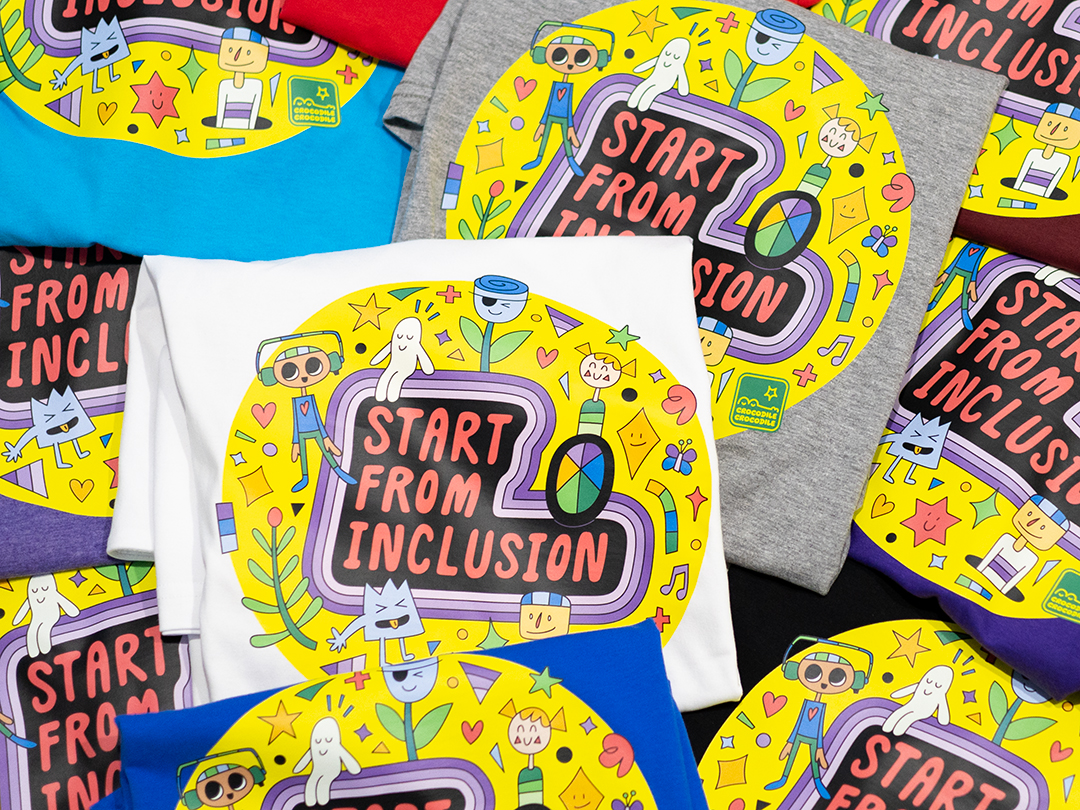Bright colourful Tshirt design with hand-drawn text "Start from Inclusion"